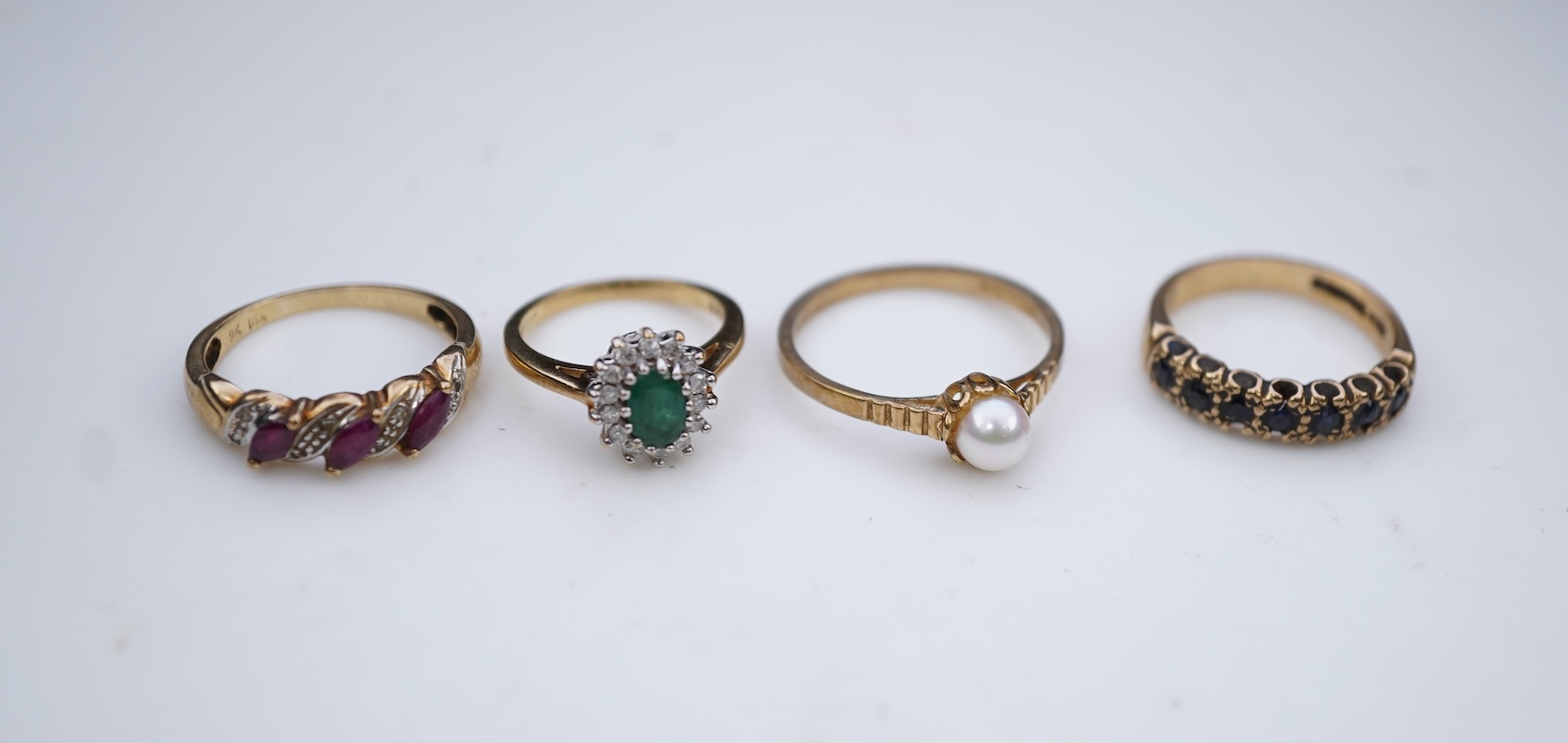 Four gem-set rings